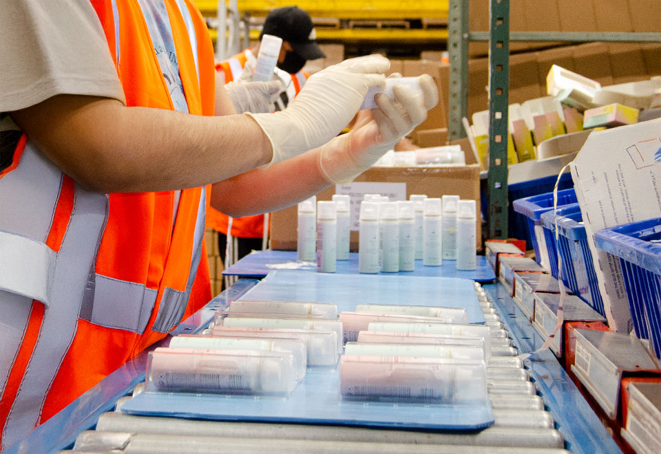 staff assembling beauty products