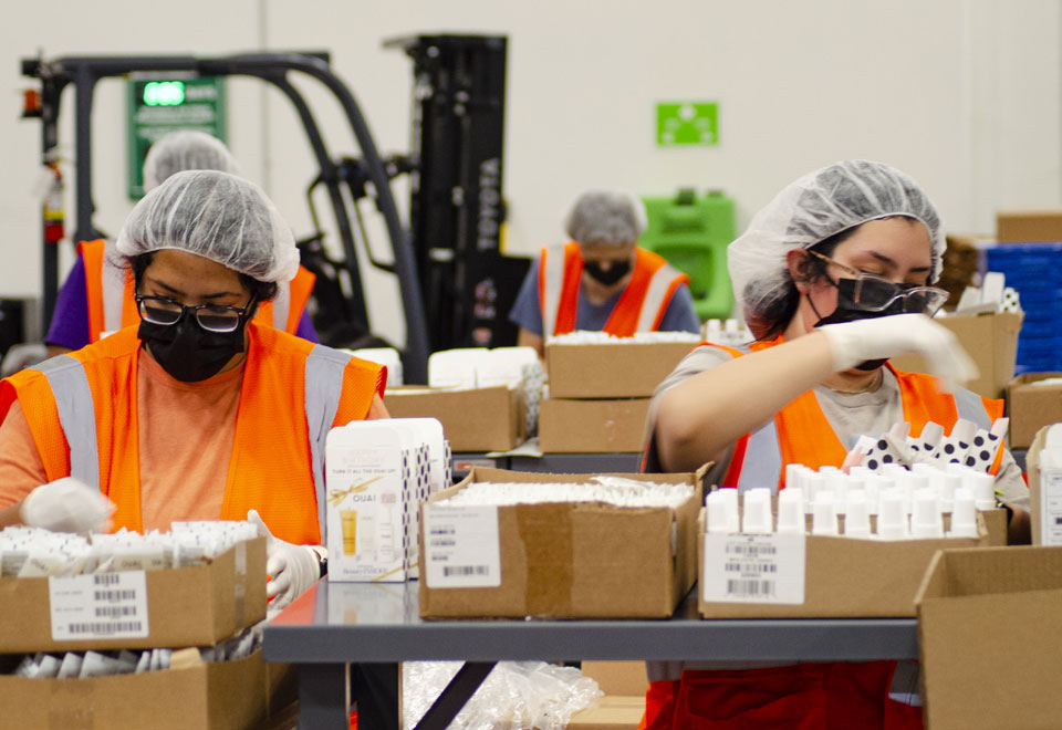 PGS360 staff in the warehouse